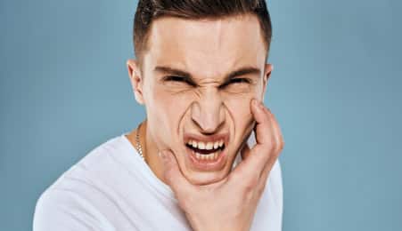 Displeased male with intense jaw pain | Brazos Place